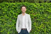 person sitting at a table on a laptop
